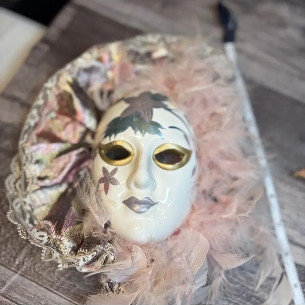 Elegant Feathered Mask with Gold and Pink Accents